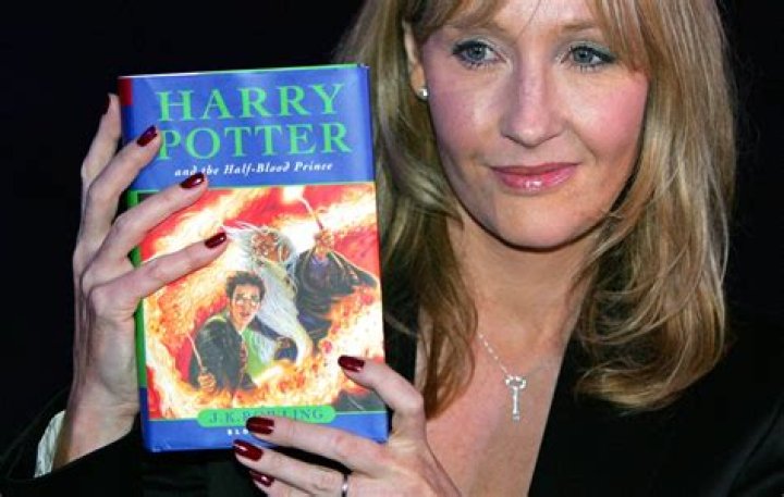 Does J.K. Rowling write her books by hand?